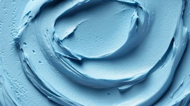 Kozmetik krem dokusu. mavi arka plan. seçici odak.