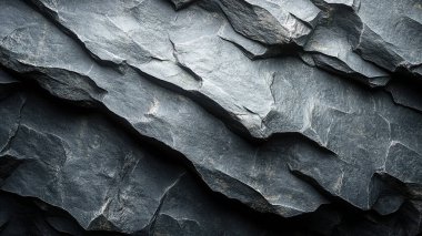 Siyah beyaz arka planı olan koyu taş bir yüzey. Doğal taş arkaplan