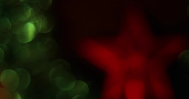 Abstract isolated blurred Christmas lights bokeh background in 4k. Great for a Christmas overlay or background. — Stockvideo