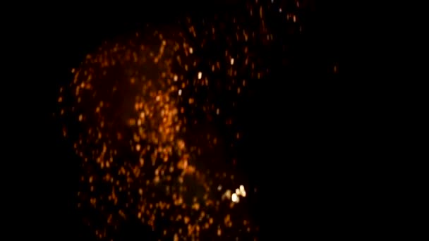 Golden glitter explosion in dark background. Glowing Particles — Stock Video