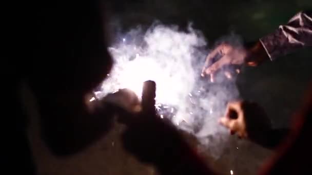 Group of friends celebrating night party with fireworks in hand. Ideal for all festival celebrations Christmas, New Year, Diwali, and many more. — Stock Video