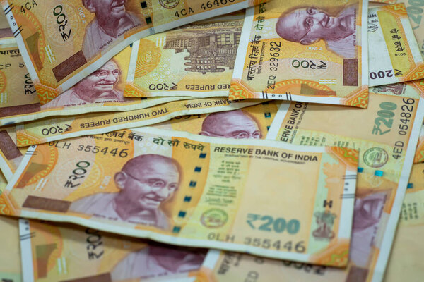 Индийские деньги и банкноты, 200 рупий. Фон бумажных индийских денег