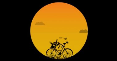Akşam romantik günbatımı arka planında kalp bisiklet sepetinden uçuyor..