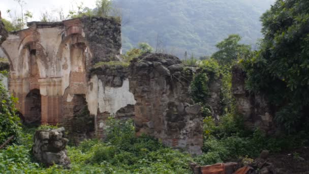 Slow wide pan of the ruined arches of an old church destroyed by an earthquake — Stock Video