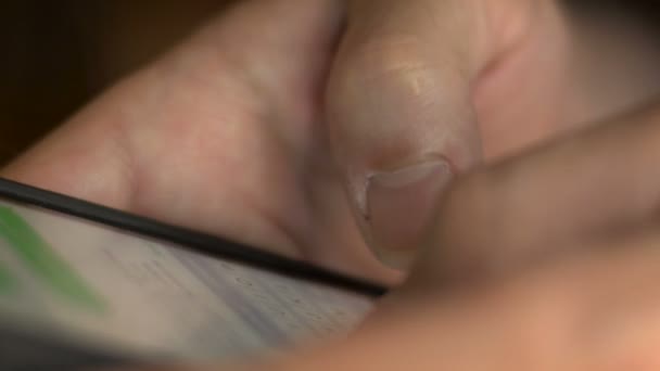 Extreme close up of man texting on his mobile cell smart phone Stock Video