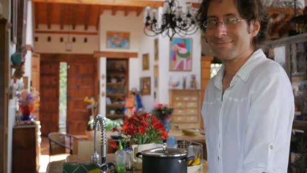 Portrait of a middle aged man wearing a white shirt in a modern home — Stock Video