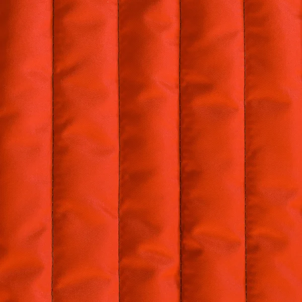 Red orange quilted textiles with insulation. — Stock Photo, Image