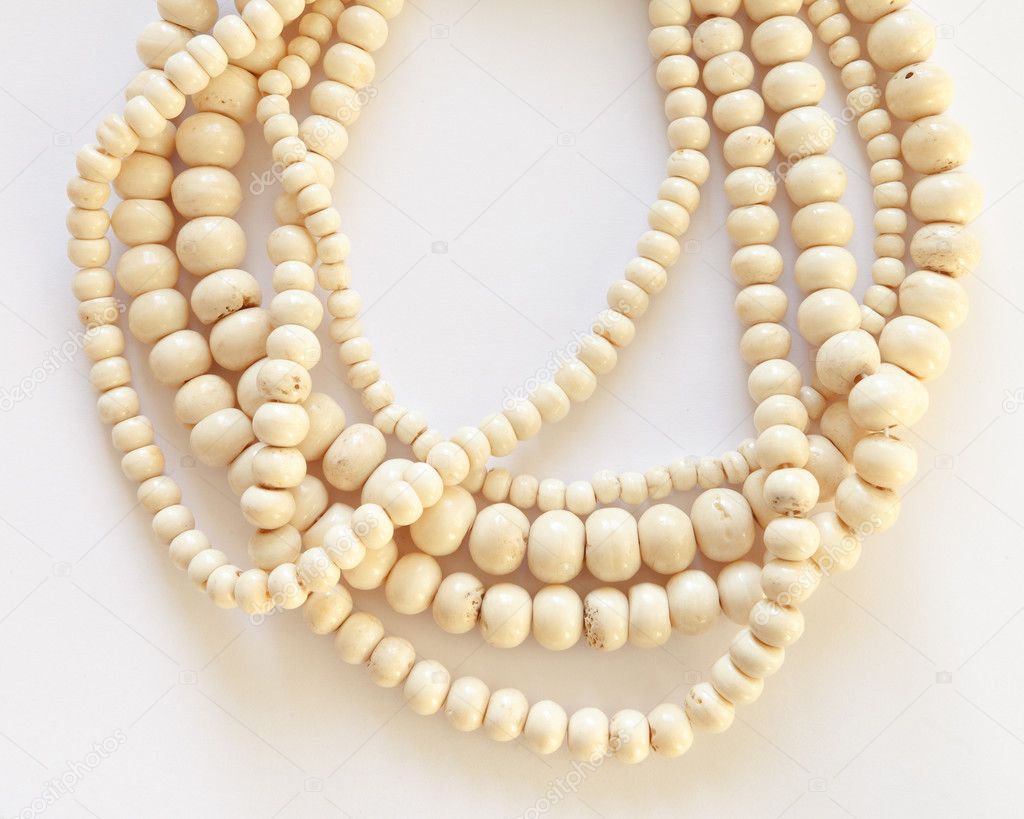 Jewelry necklace made of threads with bone beads 