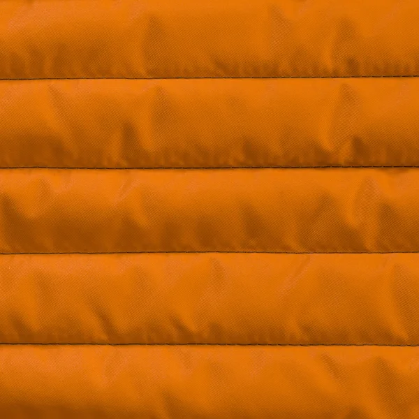 Orange yellow quilted textile with insulation texture. — Stock Photo, Image