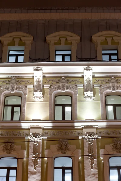 Evening lighting the front of the building in the neoclassical style.