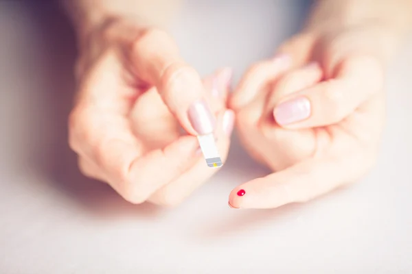 People concept - close up of female finger with blood drop and t — Stock Photo, Image