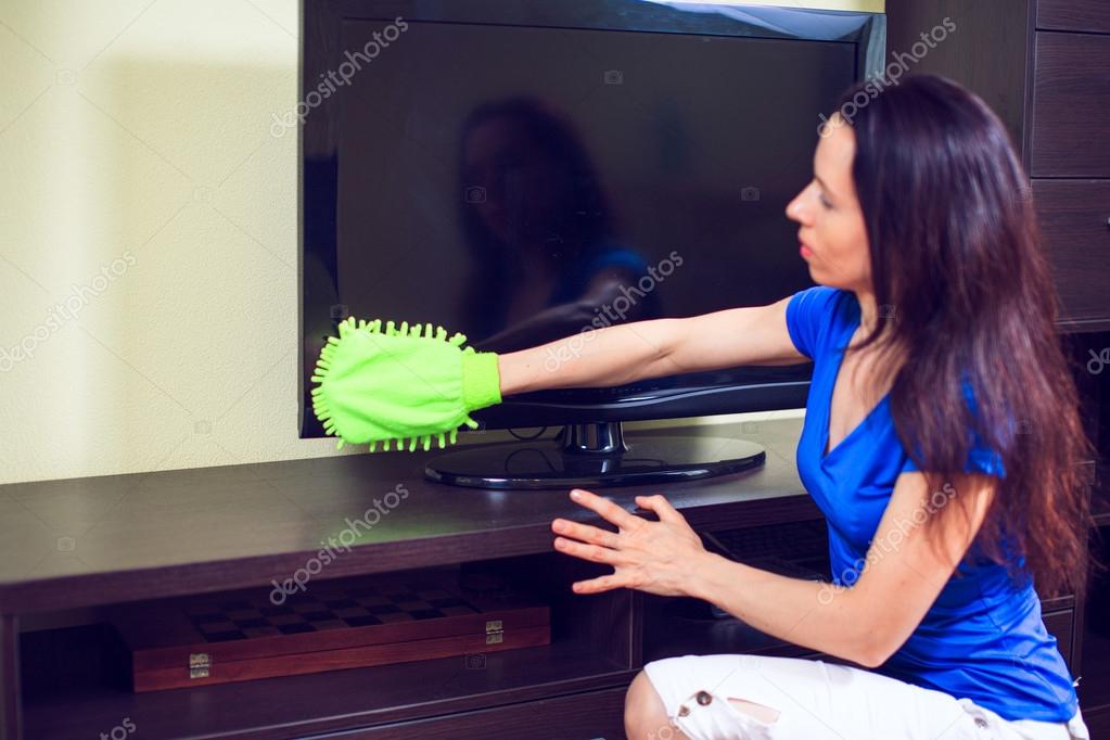 Young smiling maid. House cleaning service concept