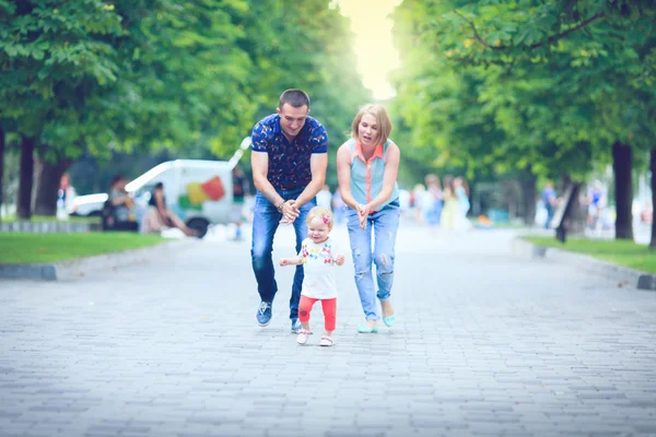 Happy family having weekend in summer park — Stock Photo, Image