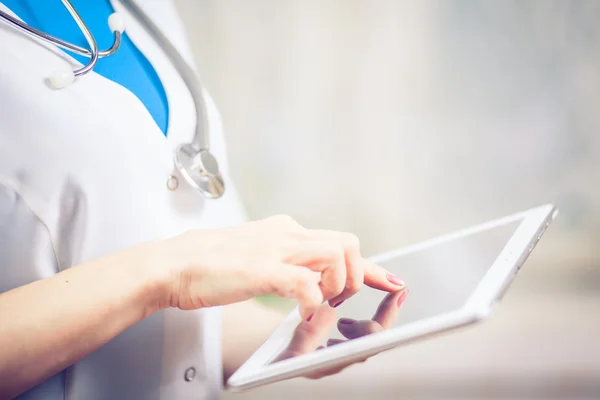 Doctor working on a digital tablet with copy space — Stock Photo, Image