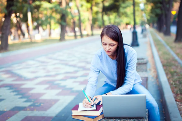 Students Walking Outdoors On University Campus