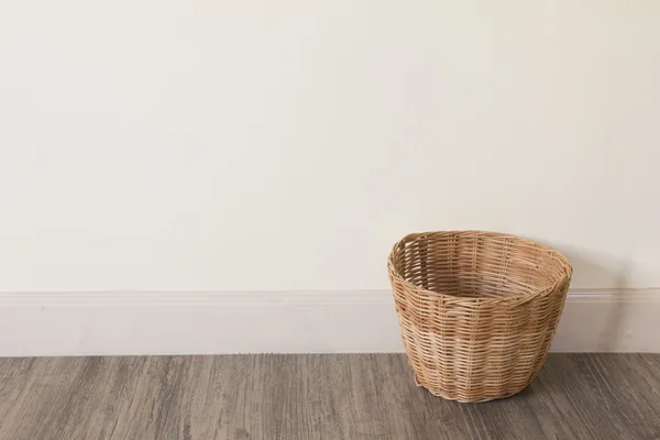 Empty basket on wooden floor