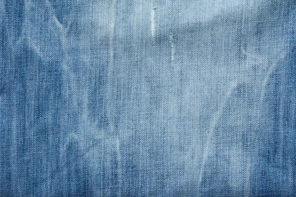 Closed up of blue creased denim jeans texture Stock Picture