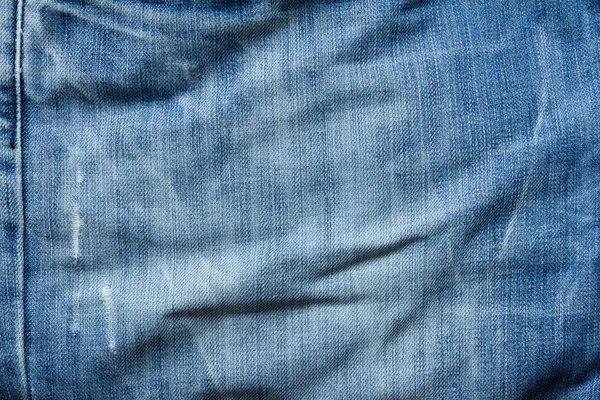 Chiuso di tessuto jeans denim blu piegato — Foto Stock