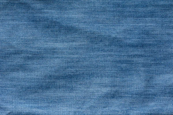 Van blauwe Gekreukte denim jeans textuur sloot — Stockfoto