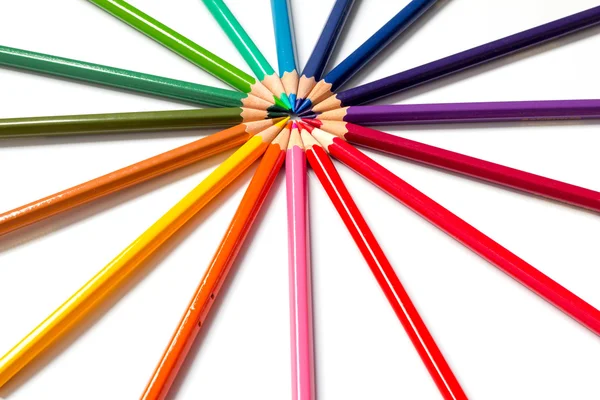 Color pencil placed as sun burst on white background — Stock Photo, Image