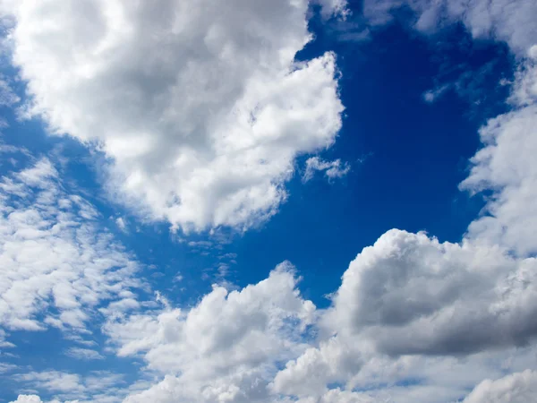 Clear blue sky with white cloud background Royalty Free Stock Photos