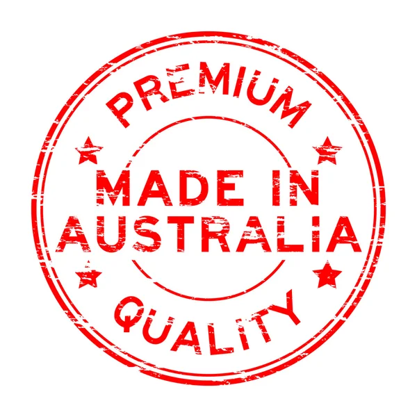 Vermelho grunge feito em austrália carimbo de borracha sobre fundo branco — Vetor de Stock