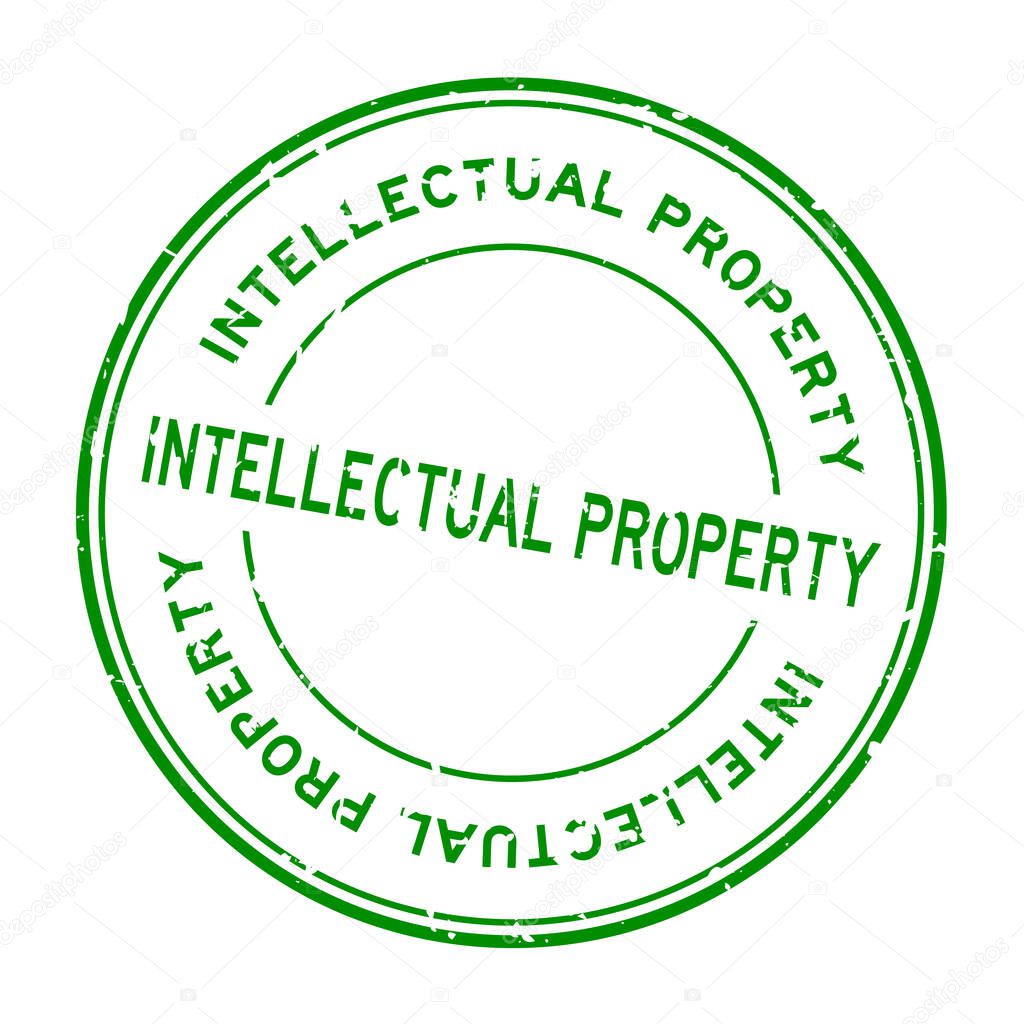 Grunge green intellectual property word round rubber seal stamp on white background