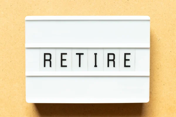 Lightbox Word Retire Wood Background — Stock Photo, Image