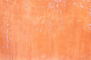 Grunge çatlamış turuncu ya da pembe renkli beton duvar. Arka plan çatı katı tarzı.