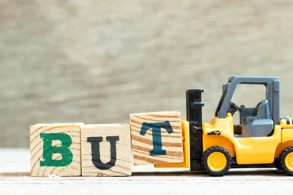 Toy Forklift Hold Letter Block Complete Word Wood Background — Stock Photo, Image