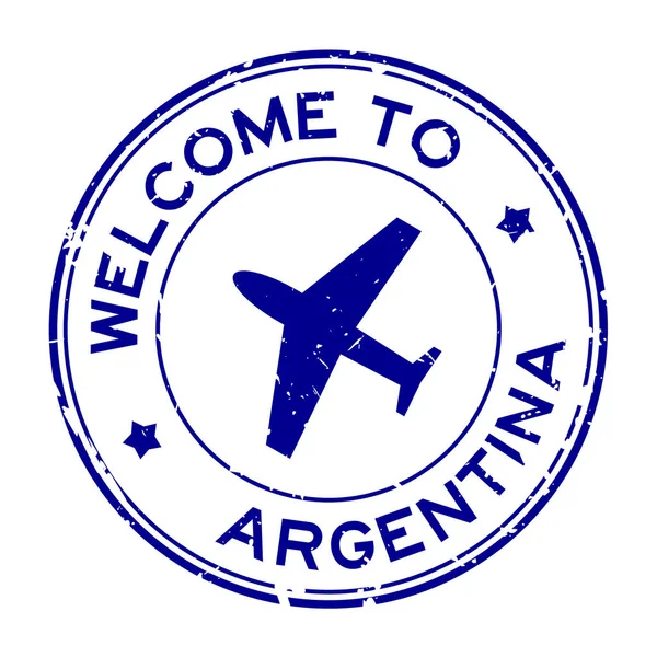 白を背景に飛行機のアイコン丸ゴムシールスタンプとアルゼンチン語へようこそグランジブルー — ストックベクタ