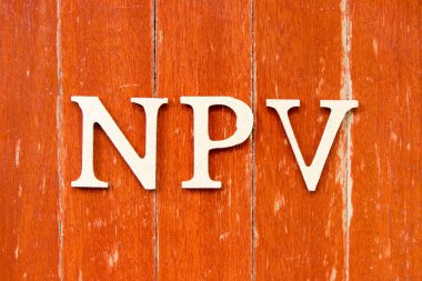 Alphabet letter in word NPV (Abbreviation of net present value) on old red color wood plate background clipart