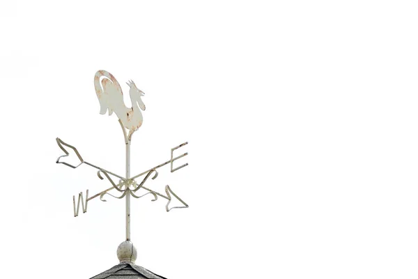 White rooster weather vane show the wind direction on white sky background