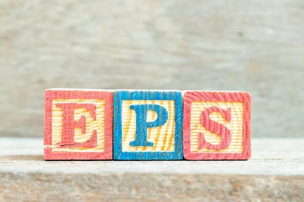 Color alphabet letter block in word EPS (Abbreviation of Earnings per share) on wood background