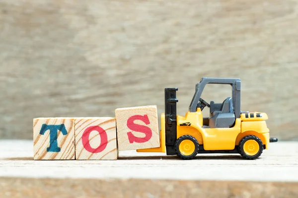 Spielzeuggabelstapler Halten Buchstabenblock Das Wort Tos Abkürzung Für Agb Auf — Stockfoto
