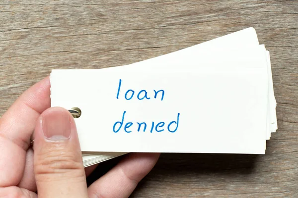 Man Hold Flash Card Handwriting Word Loan Denied Wood Background — Stock Photo, Image