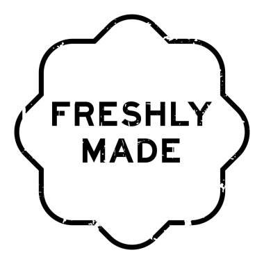 Grunge siyah, beyaz arka planda yeni yapılmış lastik mühür.