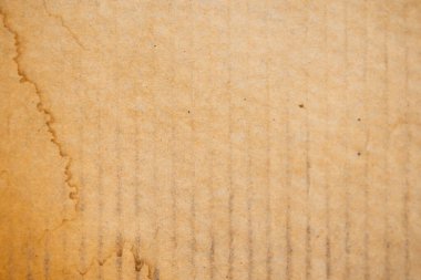 Su kahverengi kıvrımlı ambalaj malzemelerinin üzerine bulaşmış. Doku veya katman dekorasyonu olarak kullan