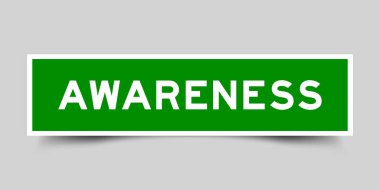 Gri arkaplanda kelime bilinci olan yeşil renkli kare biçimindeki etiket