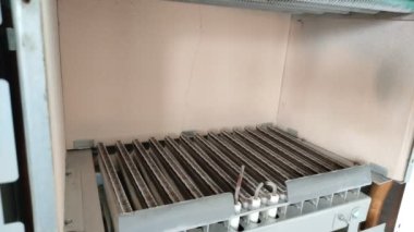 Gas ignites and burns in the heating boiler