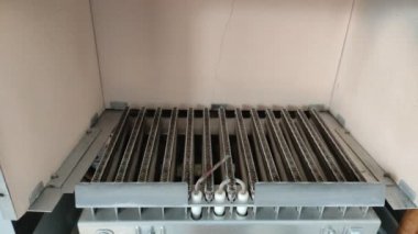 Gas ignites and burns in the heating boiler