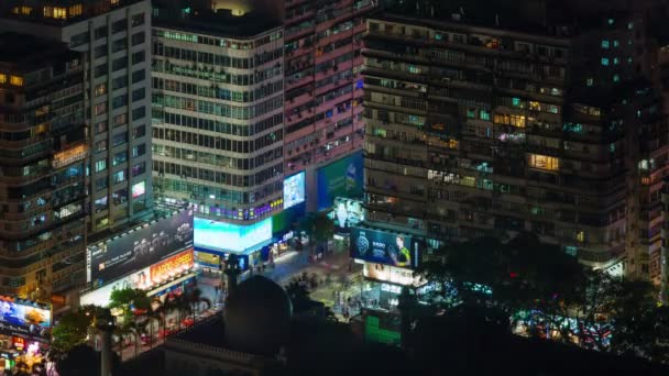4k time lapse of night traffic crossroad from roof top in hong kong china — Stock video
