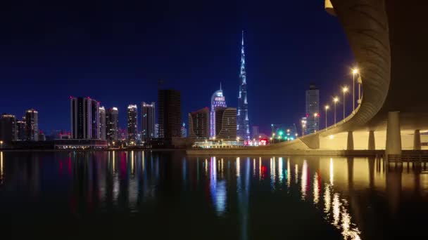 Éjszakai megvilágítás dubai világ legmagasabb épület bay panoráma 4 k idő telik el, Egyesült arab Emírségek — Stock videók