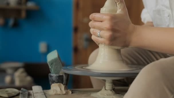 Hands working on pottery wheel — Stock Video