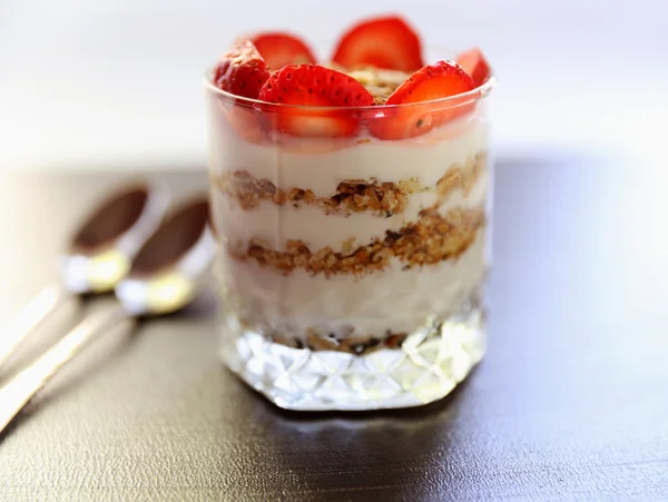 Yogurt with strawberry and granola — Stock Photo, Image