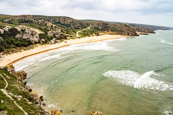 Mountains of steel and stones on the seashore. Wild beach. holidays, privacy, 