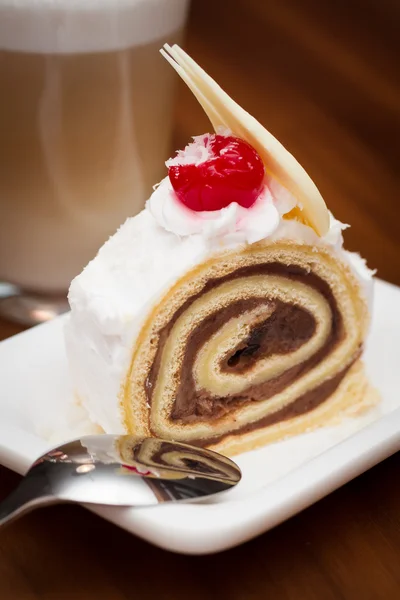 Roll Cake with pieces of white chocolate — Stock Photo, Image