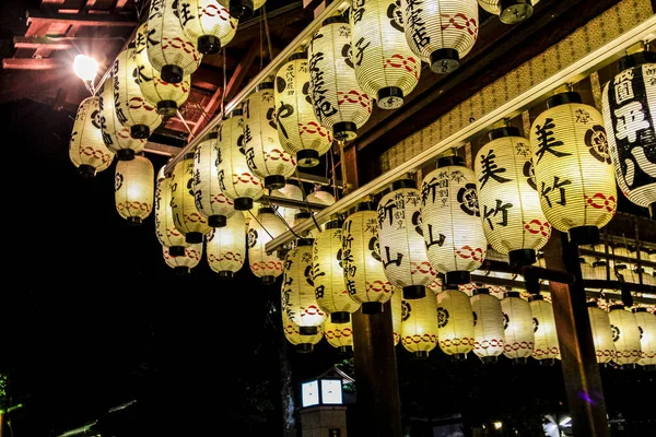 kyoto japan lanterns lit in temple. High quality photo
