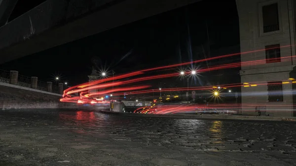 light trails of cars through the streets of Rome. High quality photo