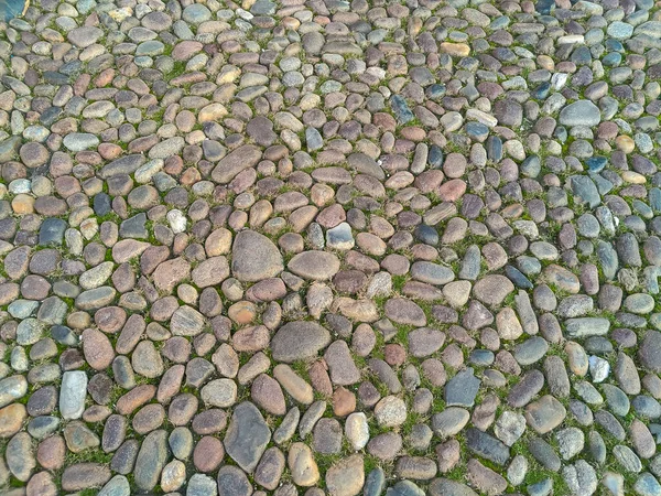 Roman cobblestone road pavement Roman road in Ferrara. High quality photo